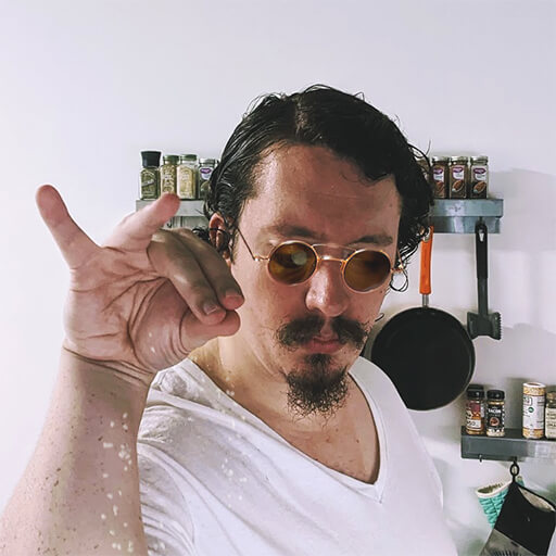 profile picture of a man with round sunglasses dropping salt